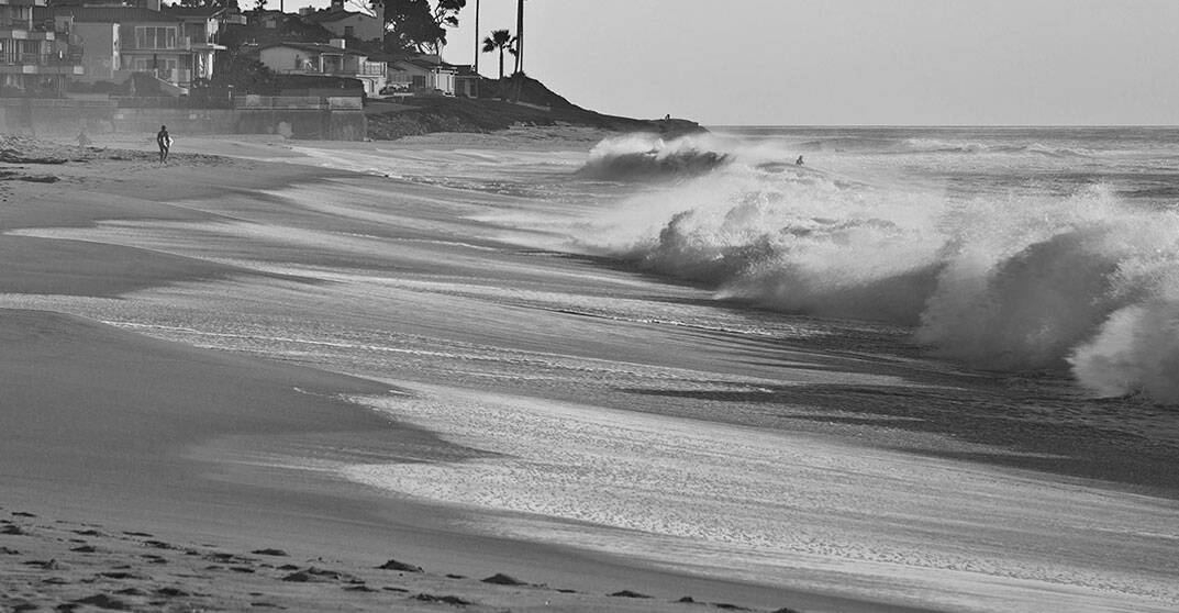 Man standing at the edge of the sea - Law Office of Jordana N. Better